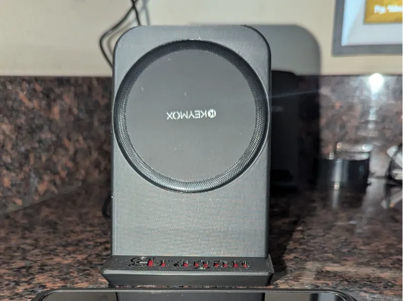 Phone stand for wireless puck charger