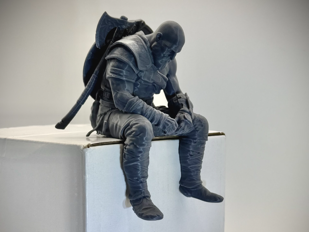 Sad Kratos Figurine sitting on a ledge!