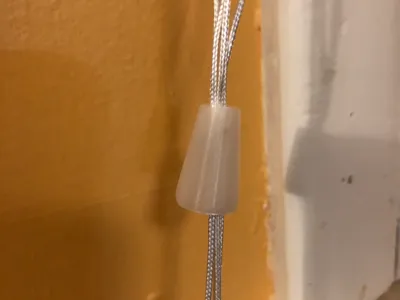 Curtain/Blinds string holder