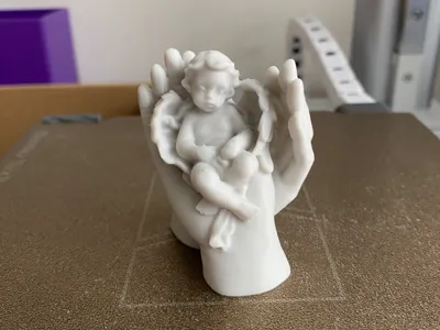 Gentle Angel in Uplifted Hands