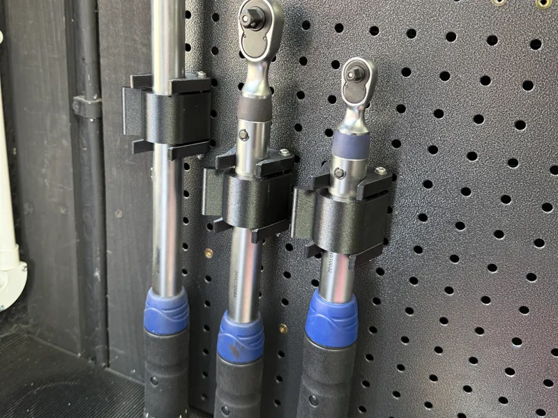 Torque wrench holder with retaining clip