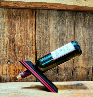 Gravity wine bottle holder