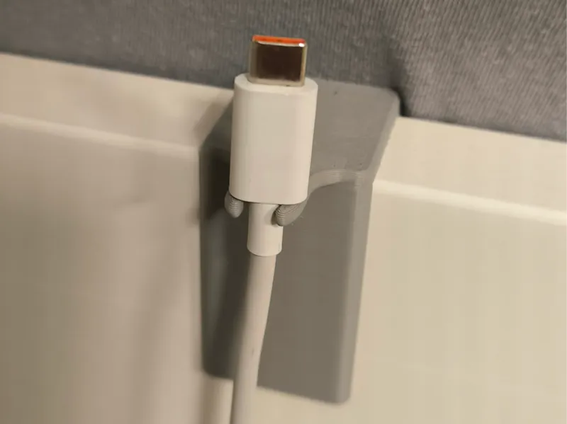 Bed charing cable holder clip
