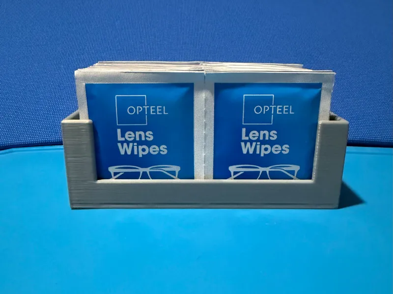 Lens wipe holder