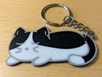 Sleepy Tuxedo Cat Keychain
