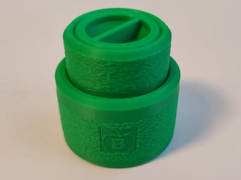 Spice grinder with compartment