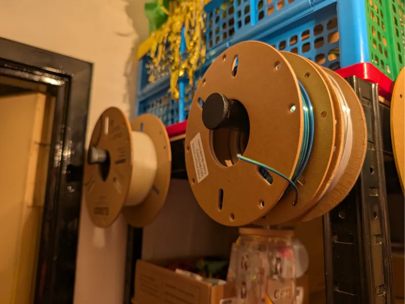 Spool holder for shelf rack