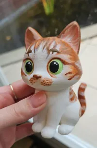Figurine de chat orange cartoon — photo 4