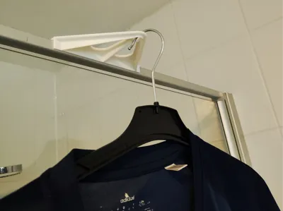 Clothes hanger hook for the shower