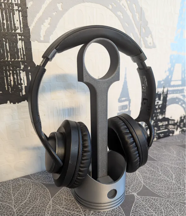Support casque en forme de piston