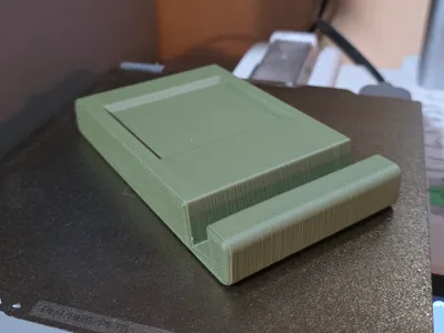 Minimalist Smartphone Stand with Earbuds Space