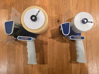 Packing tape dispenser roll retaining collar