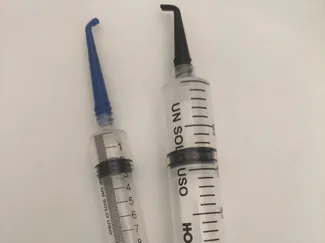 Syringe needle with a 45 and 90 degree bend.