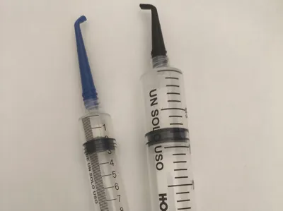 Syringe needle with a 45 and 90 degree bend.