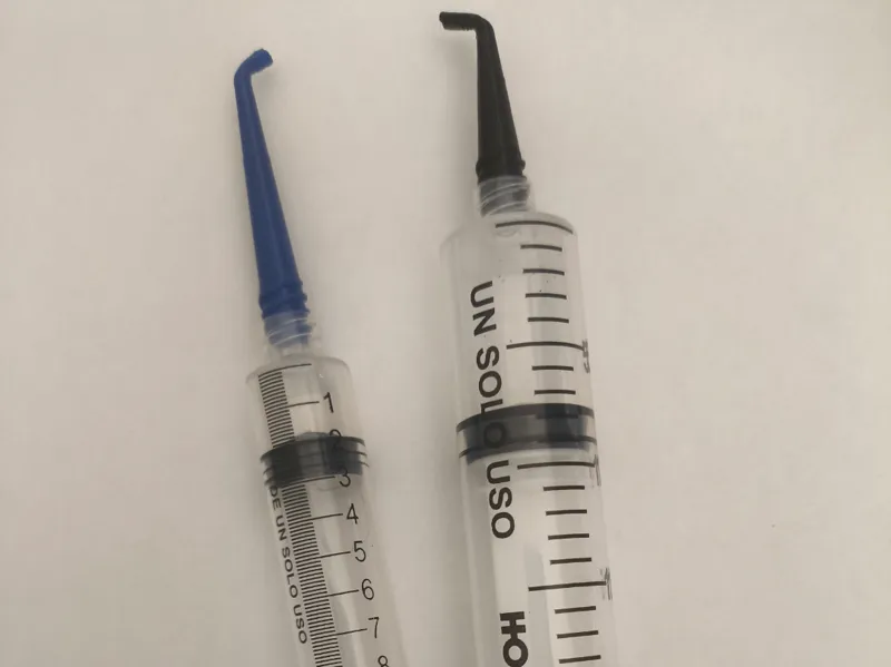 Syringe needle with a 45 and 90 degree bend.