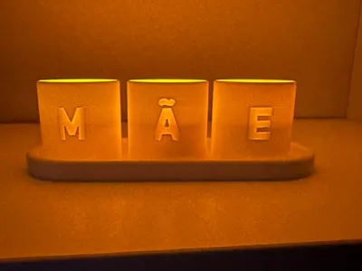 Base with illuminated cups spelling Mother