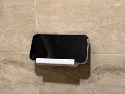 Wall-mounted phone holder