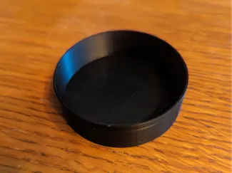 2" telescope lens base cap. Very tight fit.