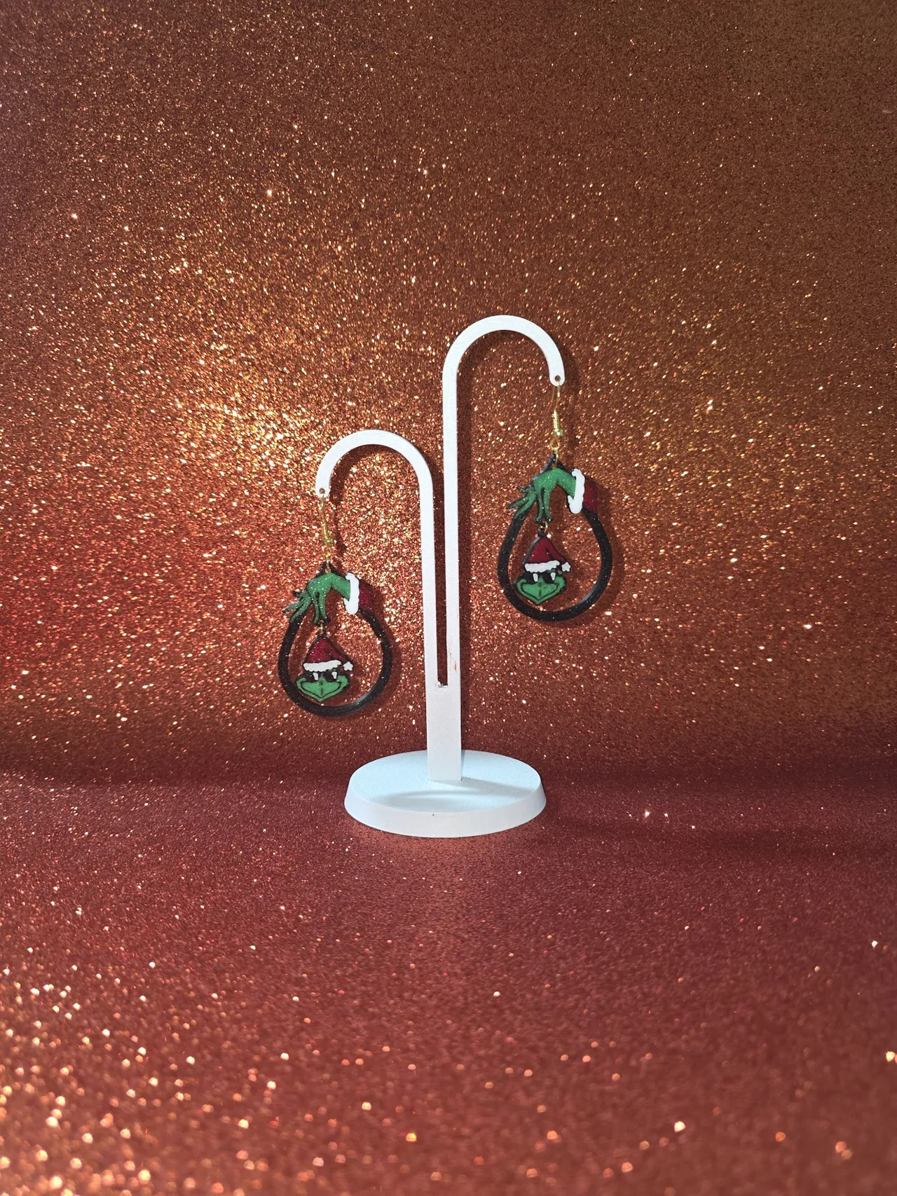 Hanging Grinch face earrings view 3