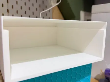 desk riser housing for draw and top slide rail