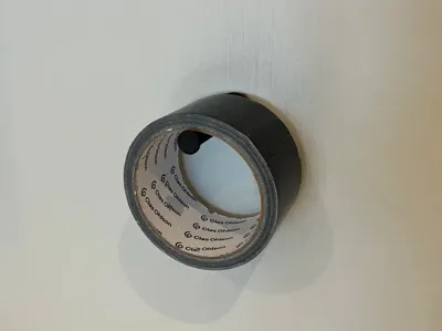 Simple wall-mounted duct tape holder