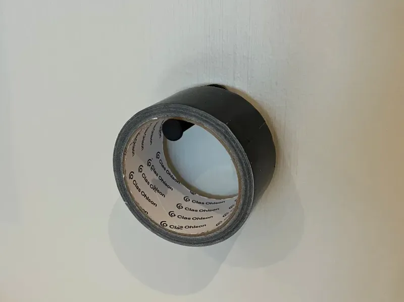 Simple wall-mounted duct tape holder
