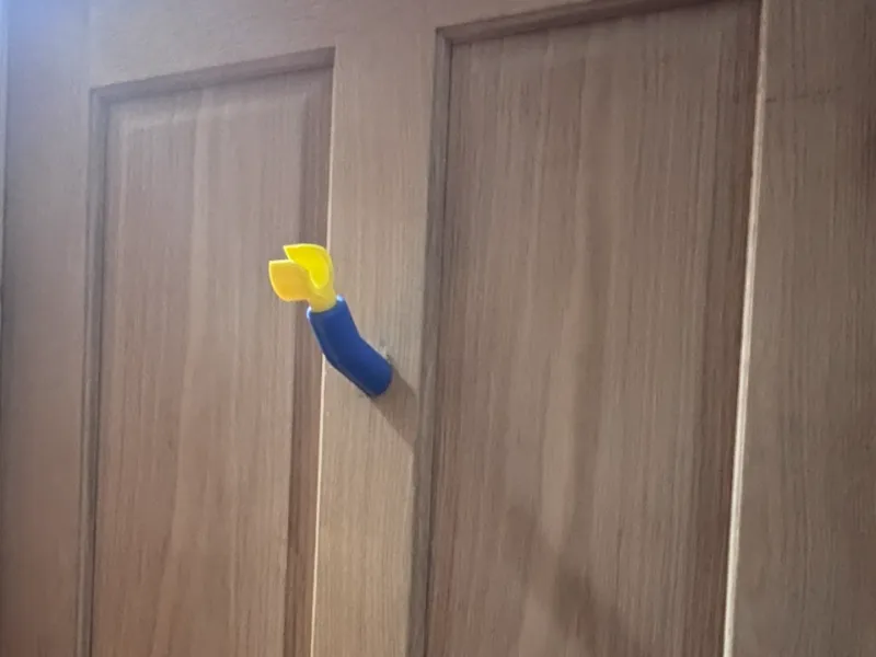 Brick man coat hook