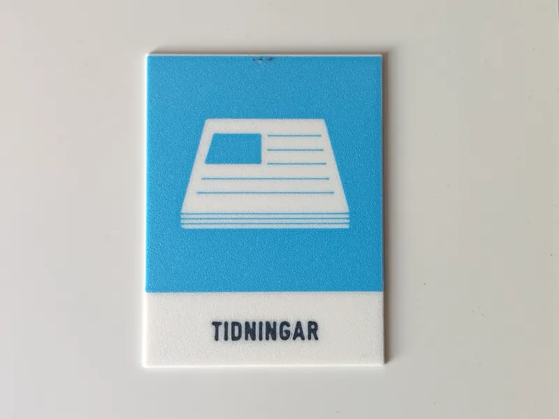Skylt för tidningar