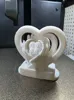 2 hearts in hands memorial with plaque