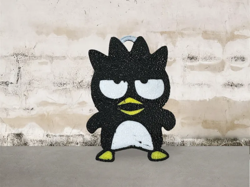 Cool Penguin (Japanese: バッドばつMaru) keychain