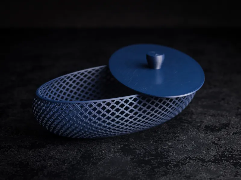 Mesh oval bowl with lid.
