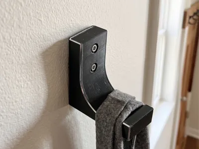 Rugged hook with beveled screw holes 