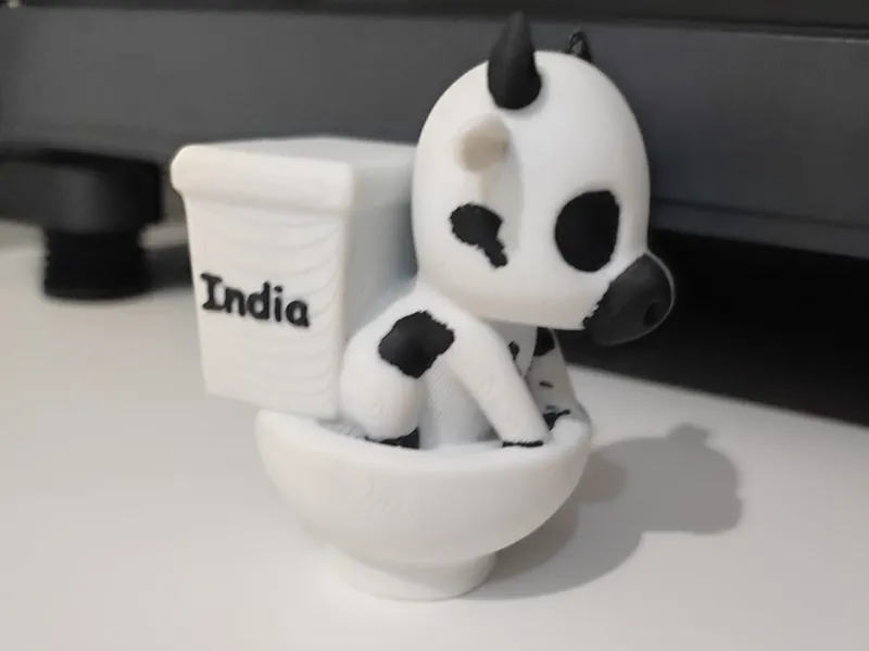 Vaca en un inodoro (cortada en dos)