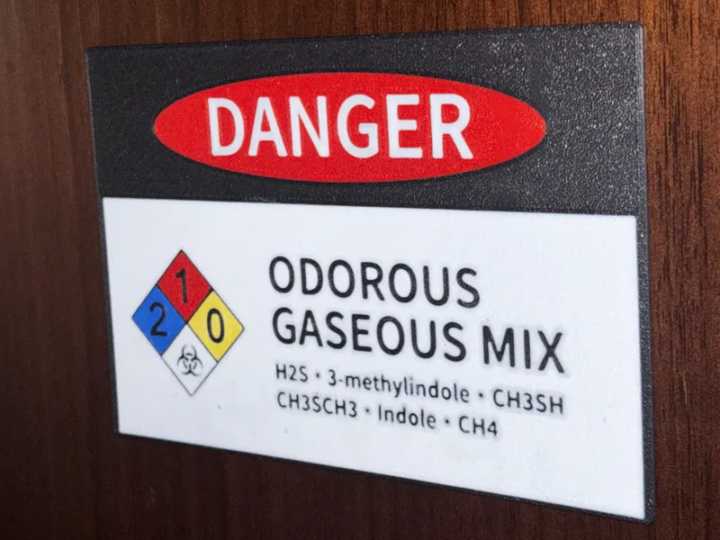 Toilet air warning sign with NFPA