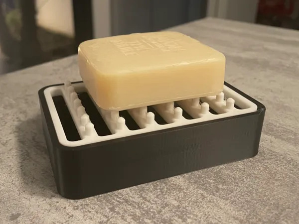 Porte-savon avec réservoir