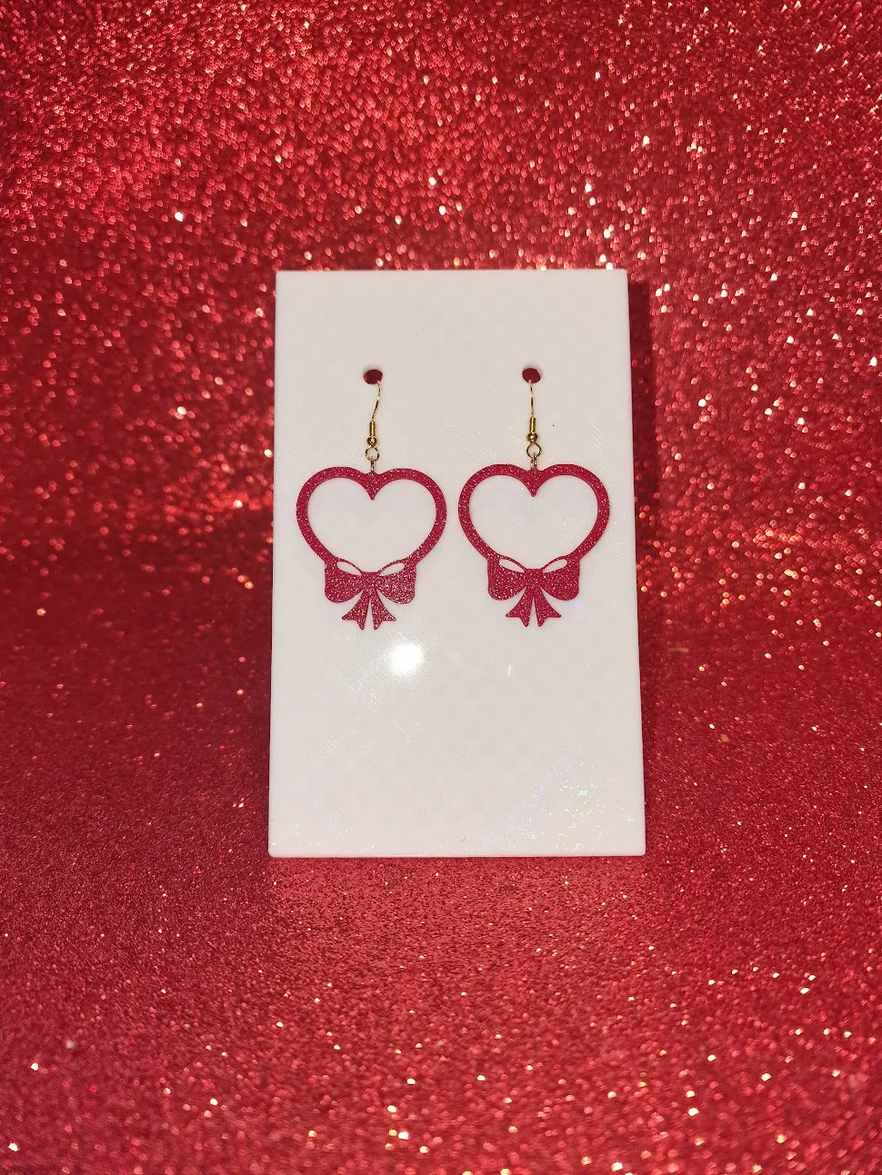 Heart bow earrings view 2