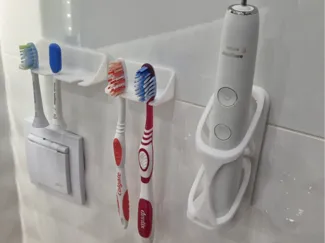 Toothbrush wall holder