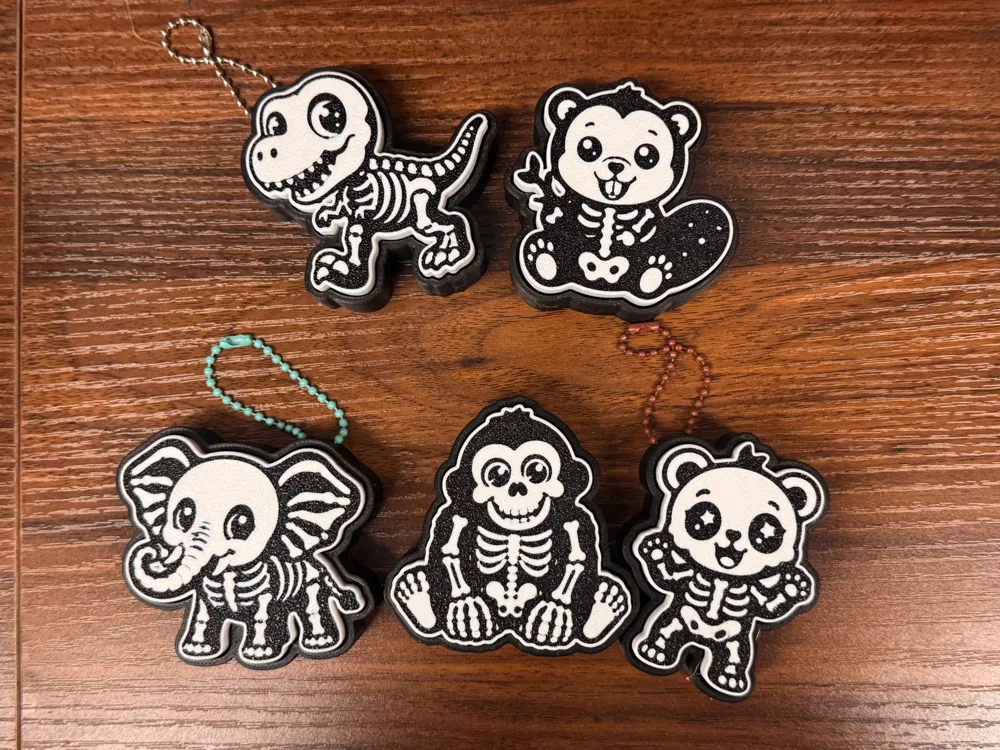 Llavero: Set of 5 animal skeleton figet clickers + keychain. Referencia del modelo original.