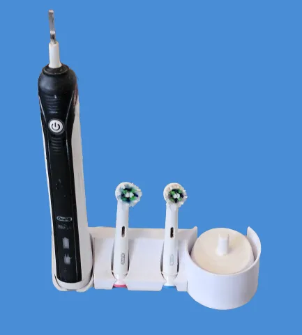 Electric toothbrush holder with charging station