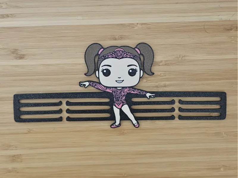 Medallero con muñeca de gimnasia ritmica