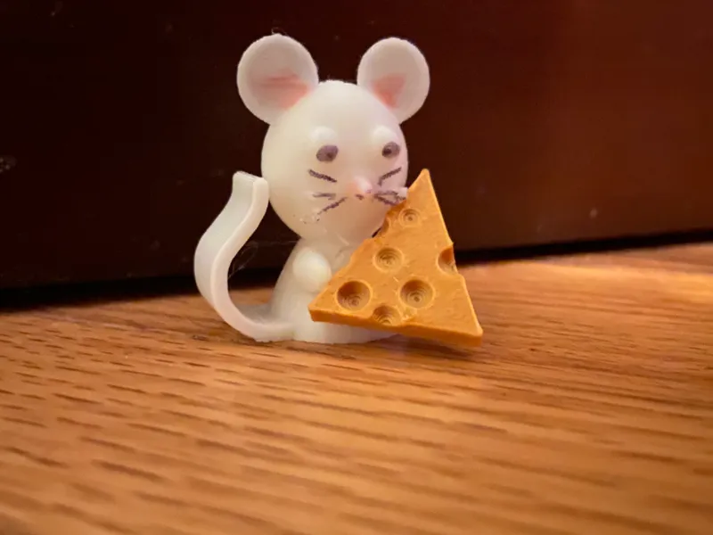 Mouse eating cheese