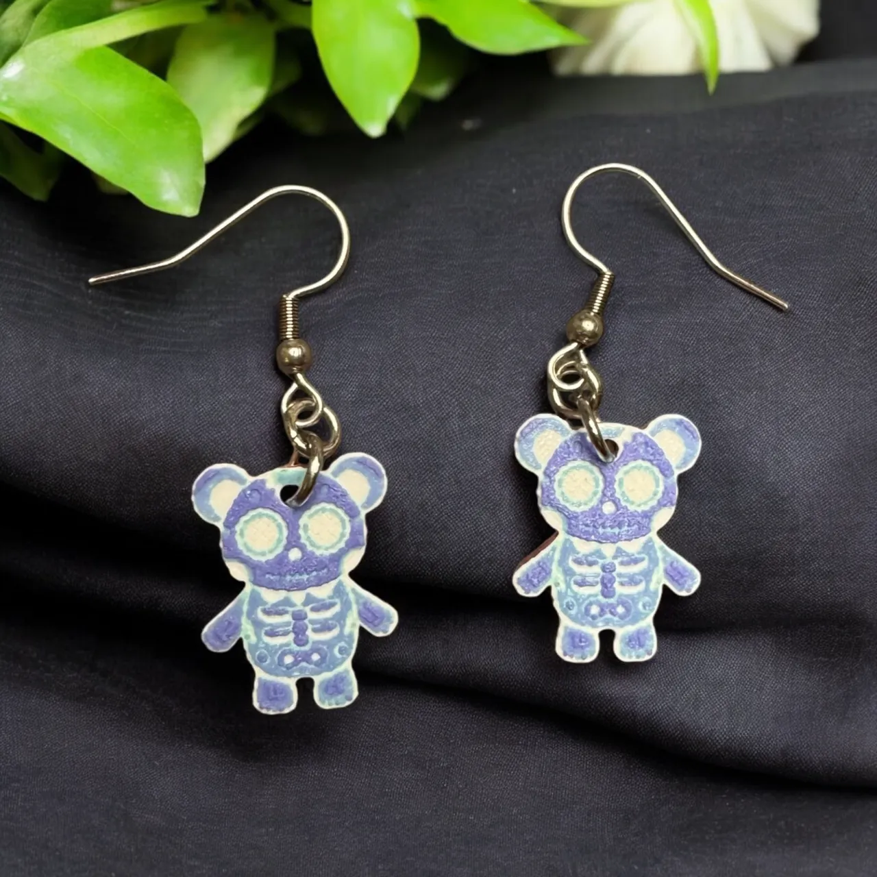 Tiny Skellington teddy bear earrings, Hueforge view 3