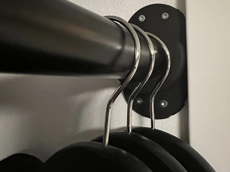 Wall-to-pipe attachment for hanging clothes.