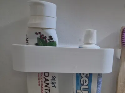 Wall toothpaste holder
