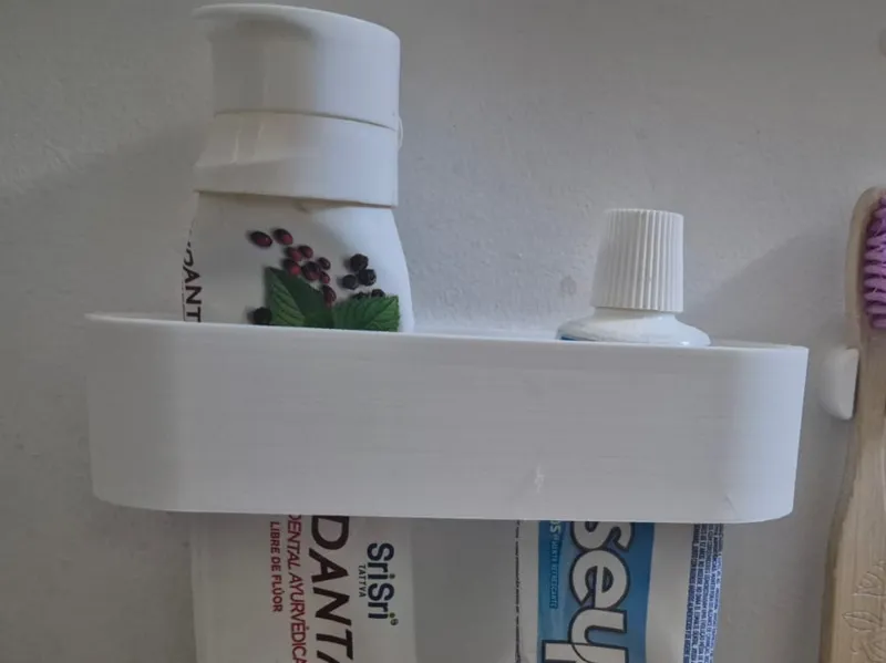 Wall toothpaste holder
