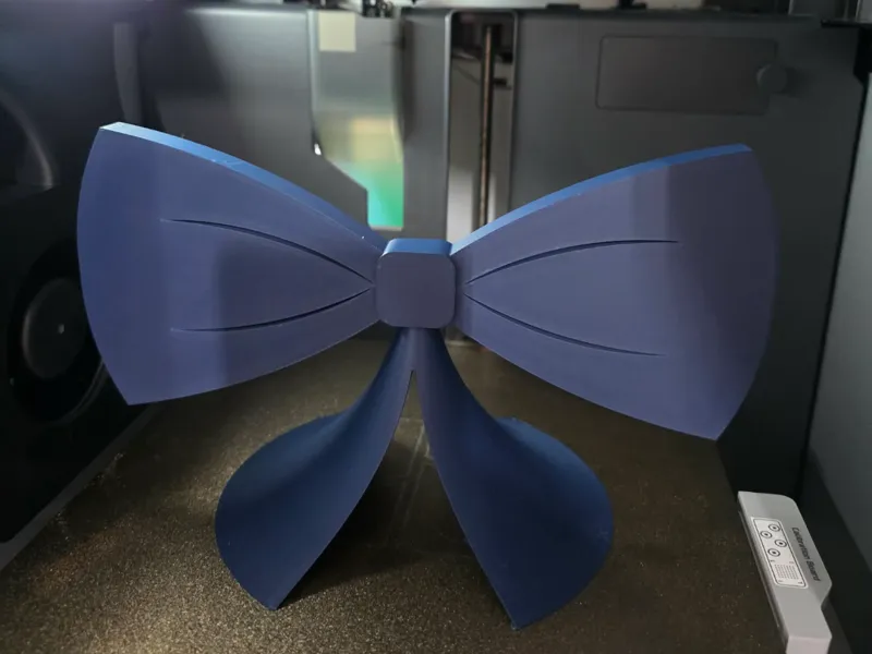 Bow shaped stand for displaying bows