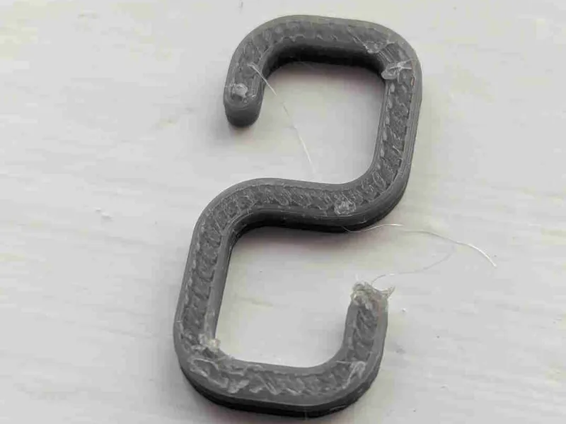 Small hook for hanging lights on net curtain rail