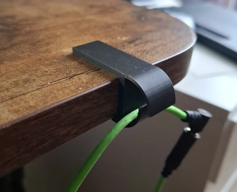 Headphones cable holder