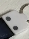 Base with decorative screw