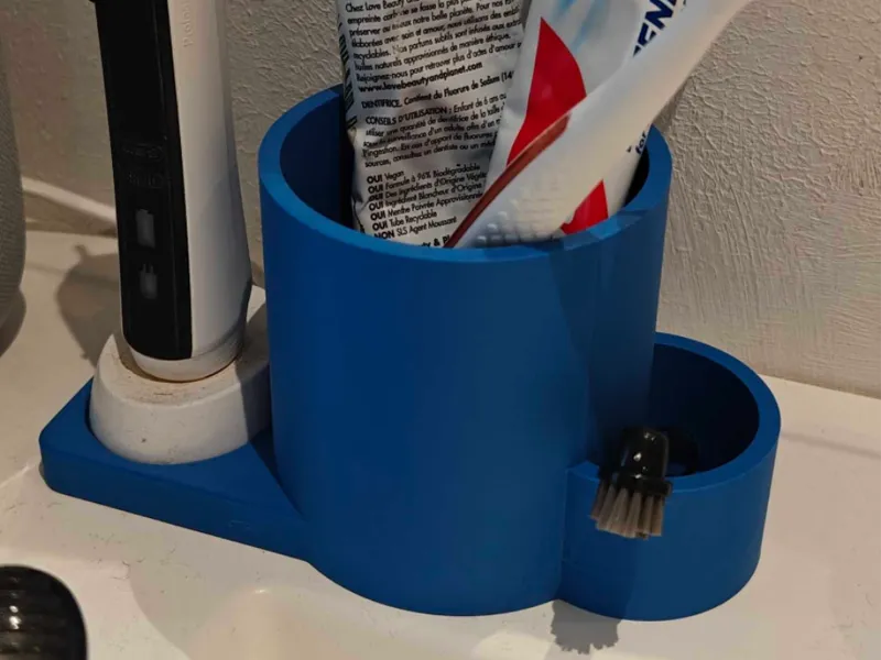 Single oral b holder with cup for tip and paste
